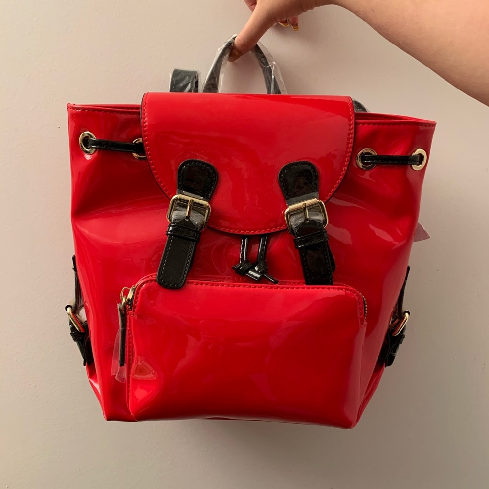 Red faux leather backpack